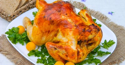 Курица на бутылке в духовке целиком