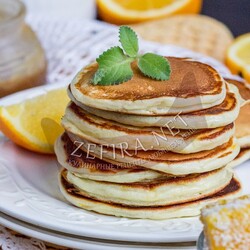 Пышные оладьи из творога с апельсином