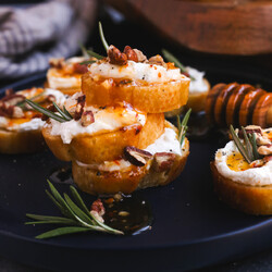 Whipped Feta Crostinis with Hot Honey and Pecans