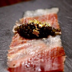 Jose's tacos - Jose Andres' appetizer: crispy seaweed, jamon, black caviar, quail egg