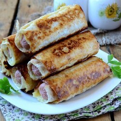 Сосиски в картофельно-сырной шубке