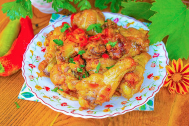 Куриные крылышки в казане на костре
