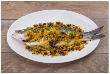 Сибас с орехами и изюмом в духовке